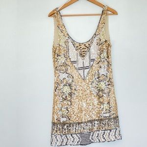 Rapsodia. Sequin gold dress.